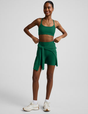 Woman wearing a green racerback bra and 5