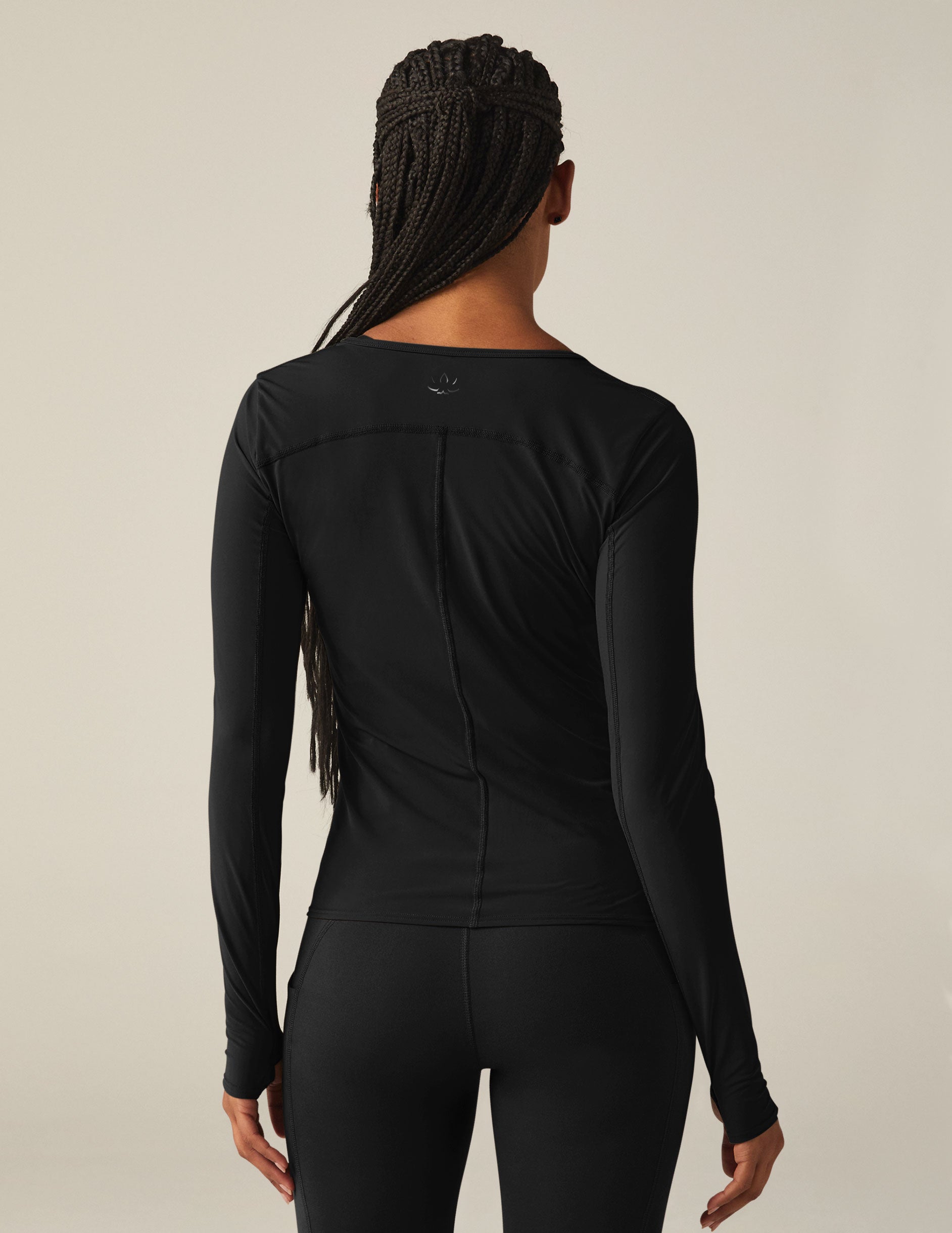 black powerbeyond lite long sleeve top with thumb holes. 