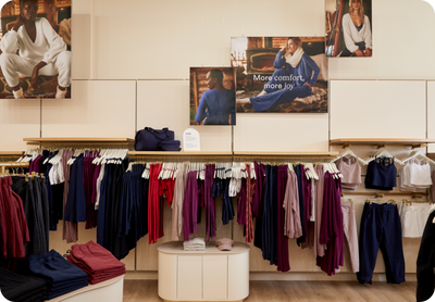 Indoor image of Irvine store with clothing and marketing imagery