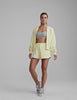 yellow terry shorts with pockets and a drawcord at waist. 