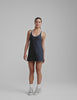 navy blue mini length dress with a front V neckline​, back keyhole detail​, contrast binding at neckline and arm openings, and an Interior bodysuit with pockets​. 