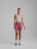 red terry shorts with pockets and a drawcord at waistband. 