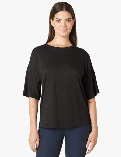 black short sleeved tee with drop shoulder detail