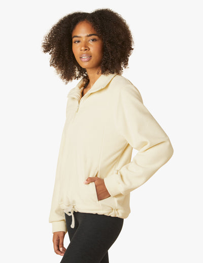 beige quater zip pullover with drawstring at waist