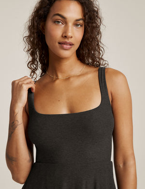black sleeveless midi loose fitting dress with square neckline and pockets