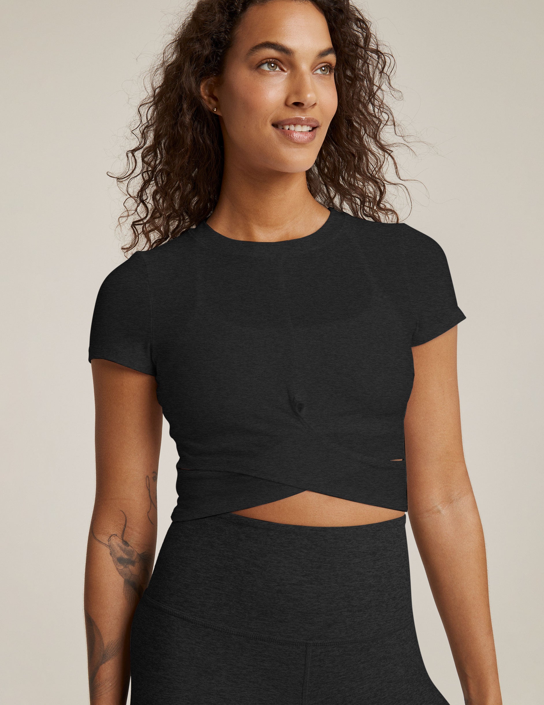 black short sleeve top with criss cross detail at front