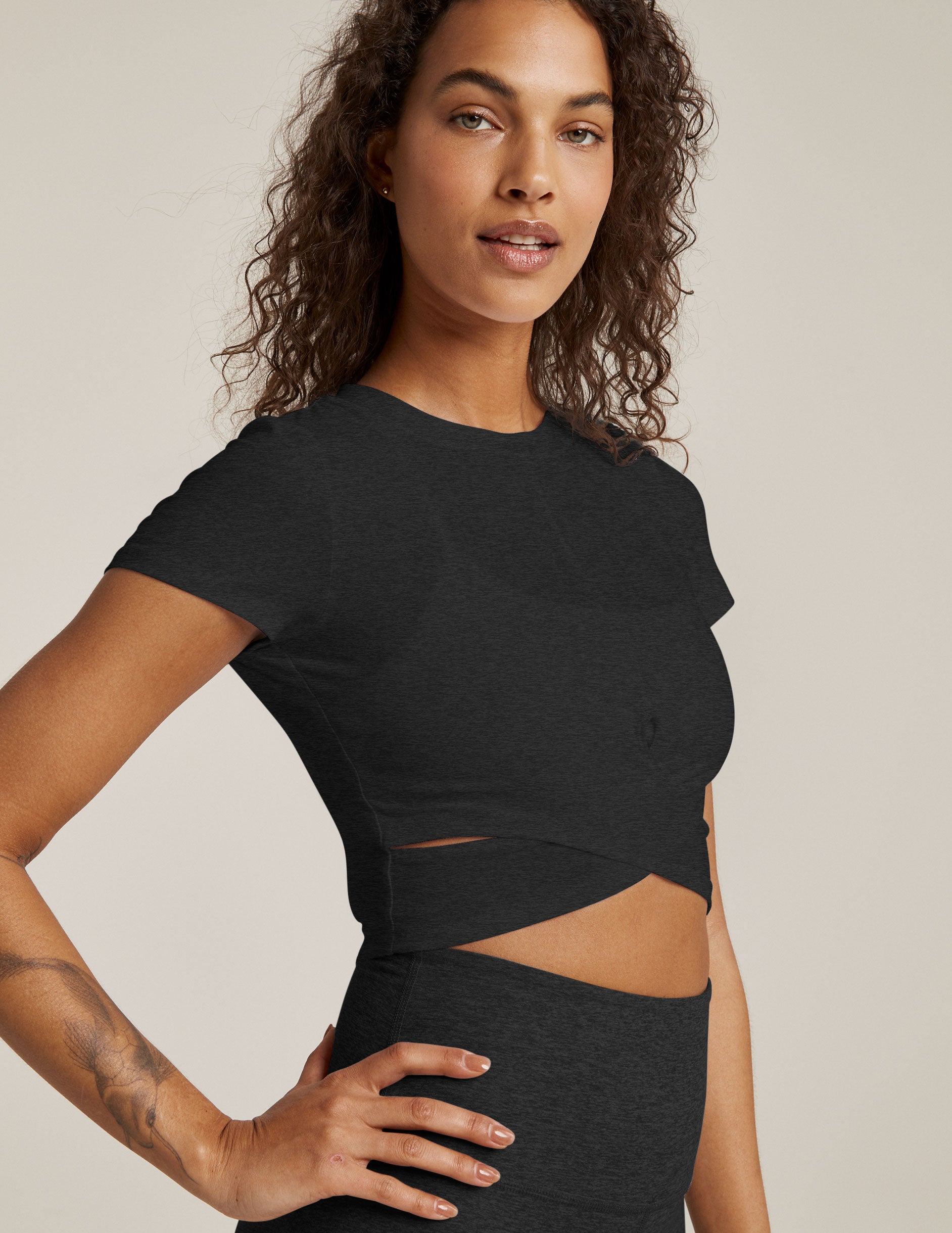 black short sleeve top with criss cross detail at front
