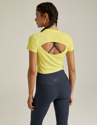 yellow short sleeve top with open back