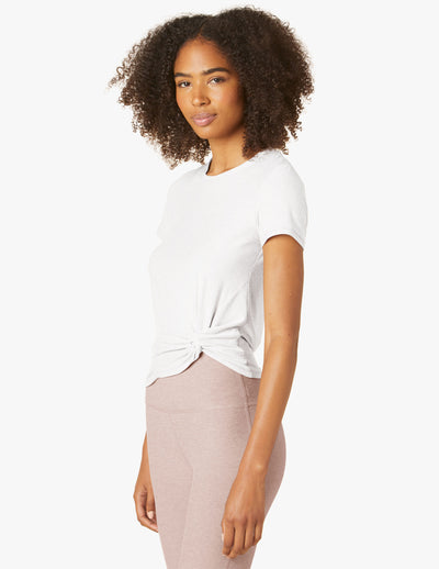 white shirtsleeved shirt with tie details are waist