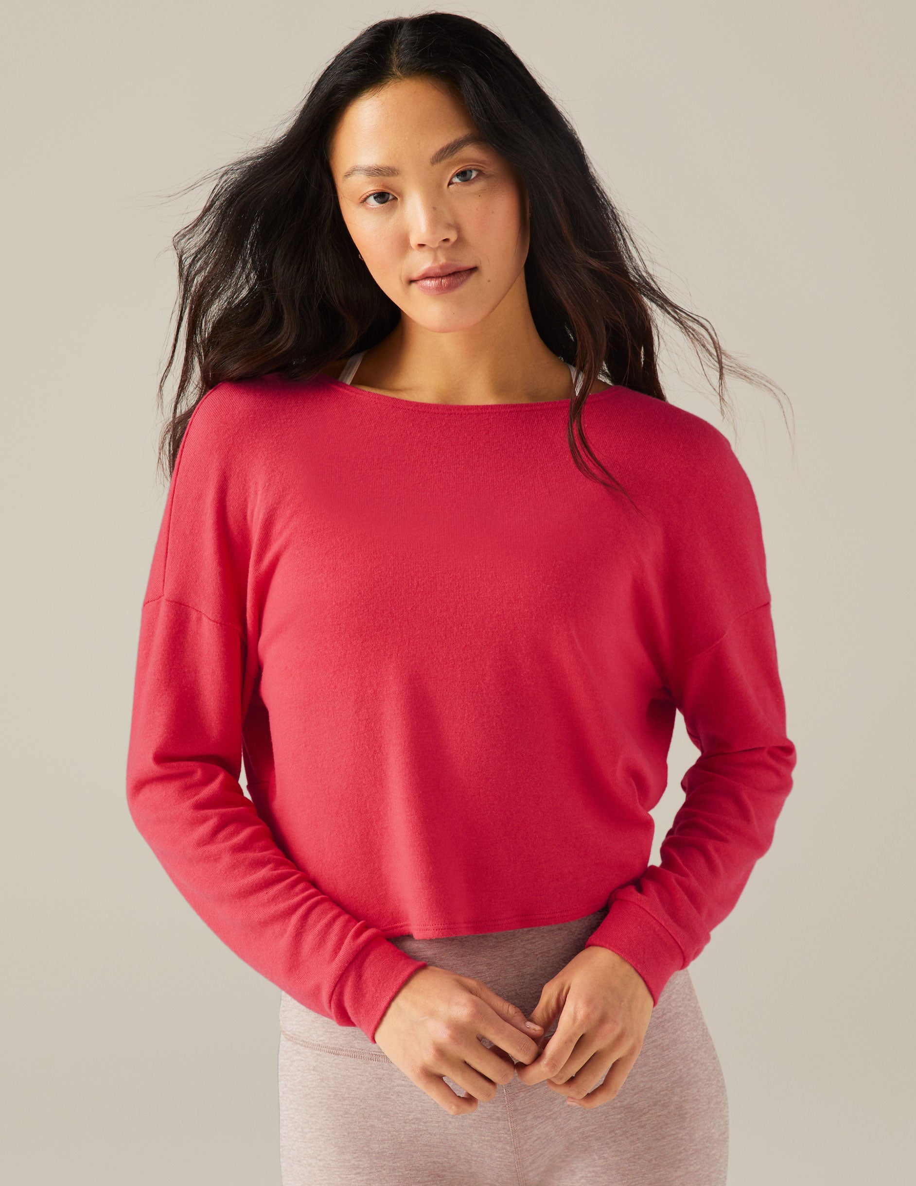 red long sleeve pullover with knot detail in back