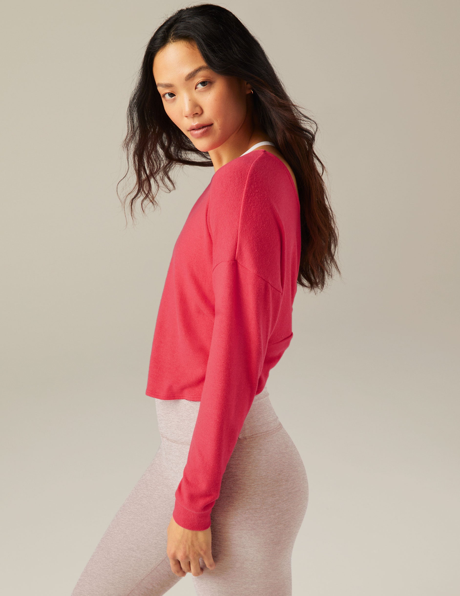 red long sleeve pullover with knot detail in back