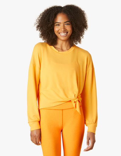 orange long sleeve pullover with tie front at waist