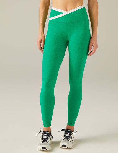 green and white midi legging with criss cross front detail