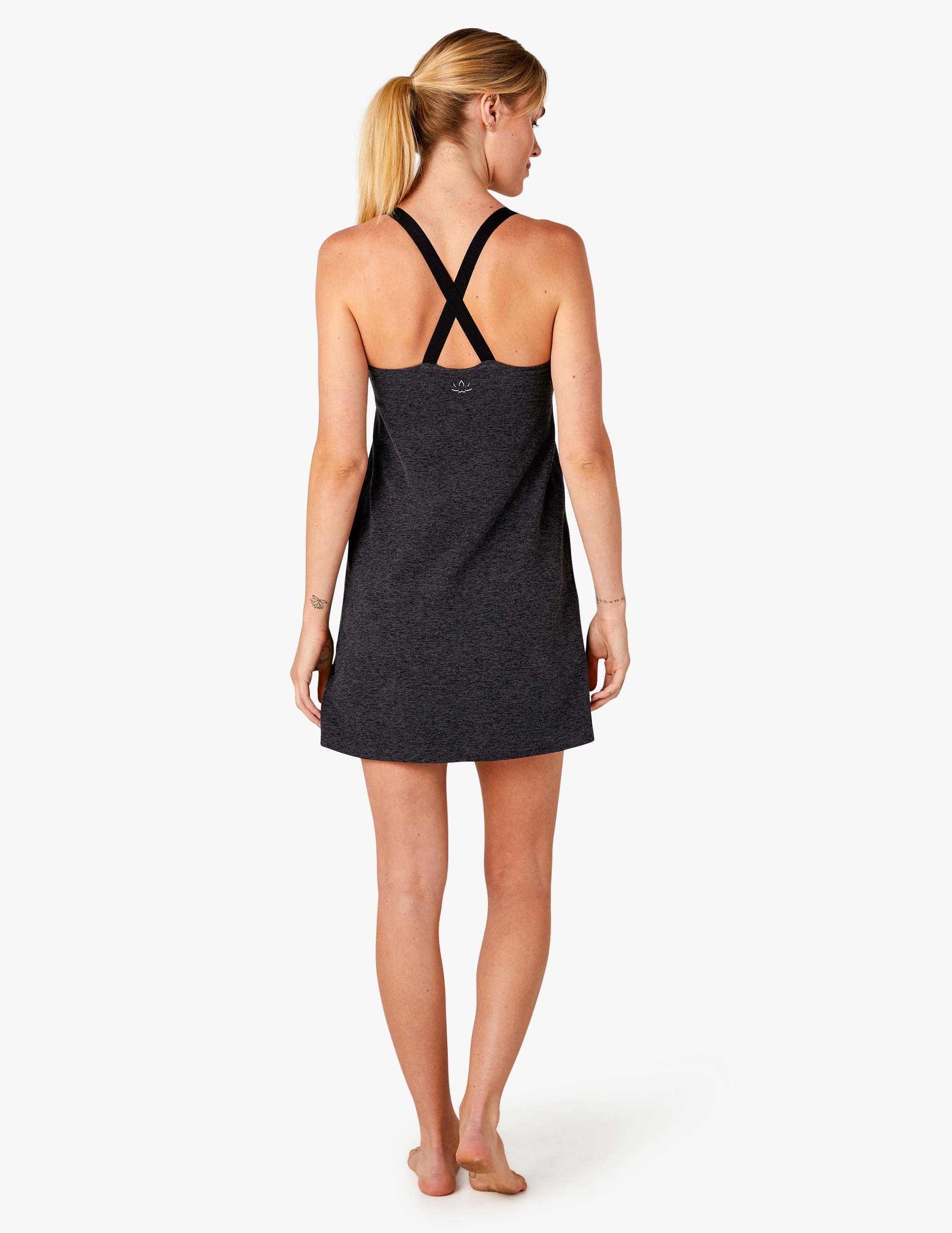 dark gray sleeveless  short slim fitting dress with cross straps and built in compression shorts