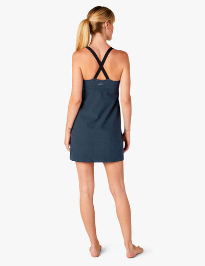 blue sleeveless short slim fitting dress with cross straps and built in compression shorts