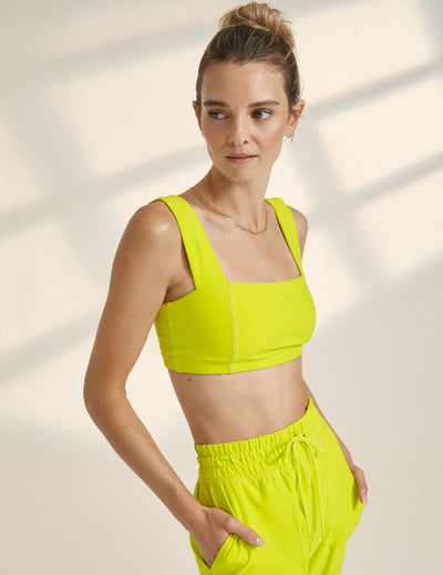 neon yellow sport bra top paired with neon yellow jogger with drawstring at waist